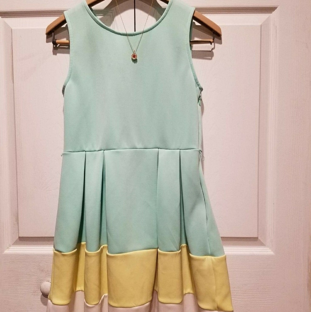 I am selling a light green,yellow, and white dress